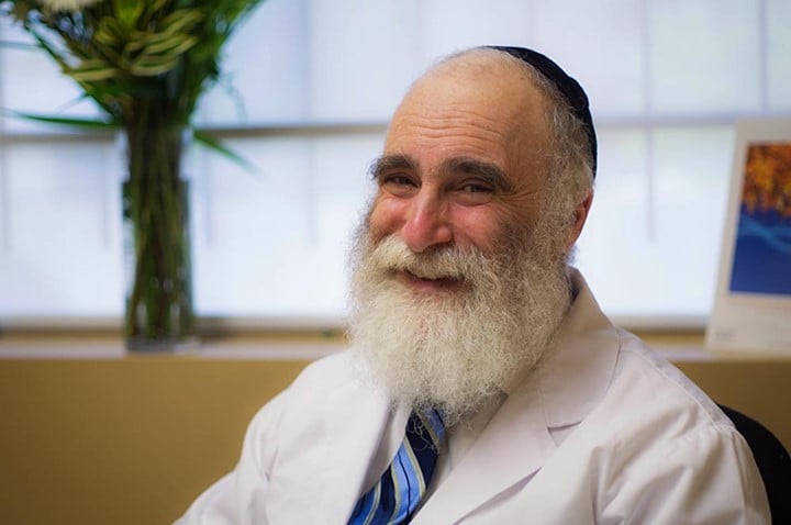 dr goldberg smiling in his office